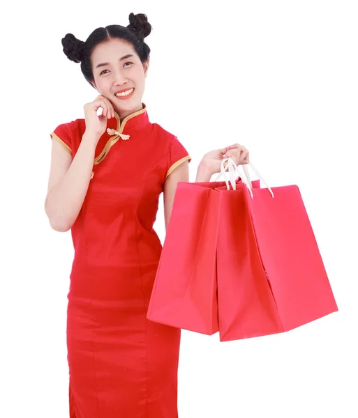 Happy woman holding shopping bag on chinese new year celebration — Stock Photo, Image