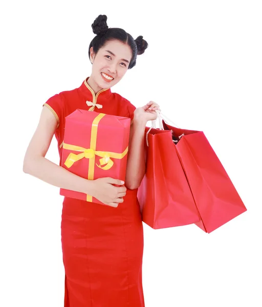 Happy woman holding shopping bag and red gift box in concept chi — Stock Photo, Image