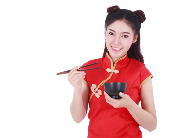 Woman wearing chinese cheongsam dress with chopsticks and bowl i — Stock Photo, Image