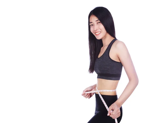 Žena měřící pás s páskou izolovaných na bílém pozadí — Stock fotografie