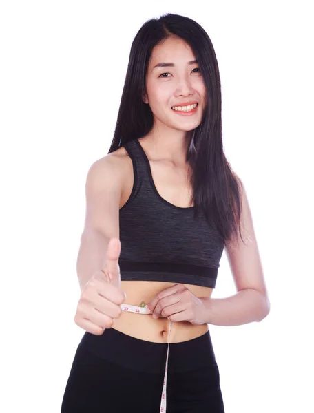 Mujer fitness con cinta métrica y mostrando el pulgar hacia arriba signo isol —  Fotos de Stock