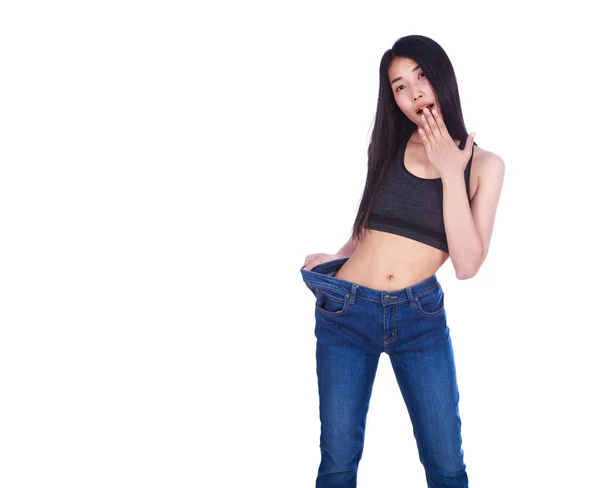 重量 isol を失った後の古いジーンズでショックを受けたスリム フィットネス女性 — ストック写真