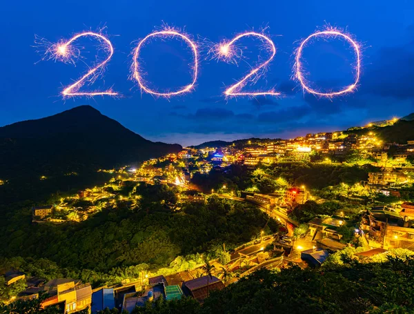 2020 happy new year fireworks over Jiufen old street city at nig