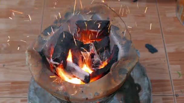 Burning charcoal in stove for preparing  traditional food of Thailand. It is popular for all homes in cooking with a stove that provides high thermal energy and economical. — Stock Video