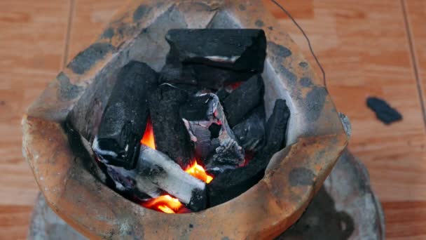 Burning charcoal in stove for preparing  traditional food of Thailand. It is popular for all homes in cooking with a stove that provides high thermal energy and economical. — Stock Video