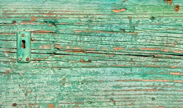 Gros plan sur la serrure d'une vieille porte verte en bois — Photo