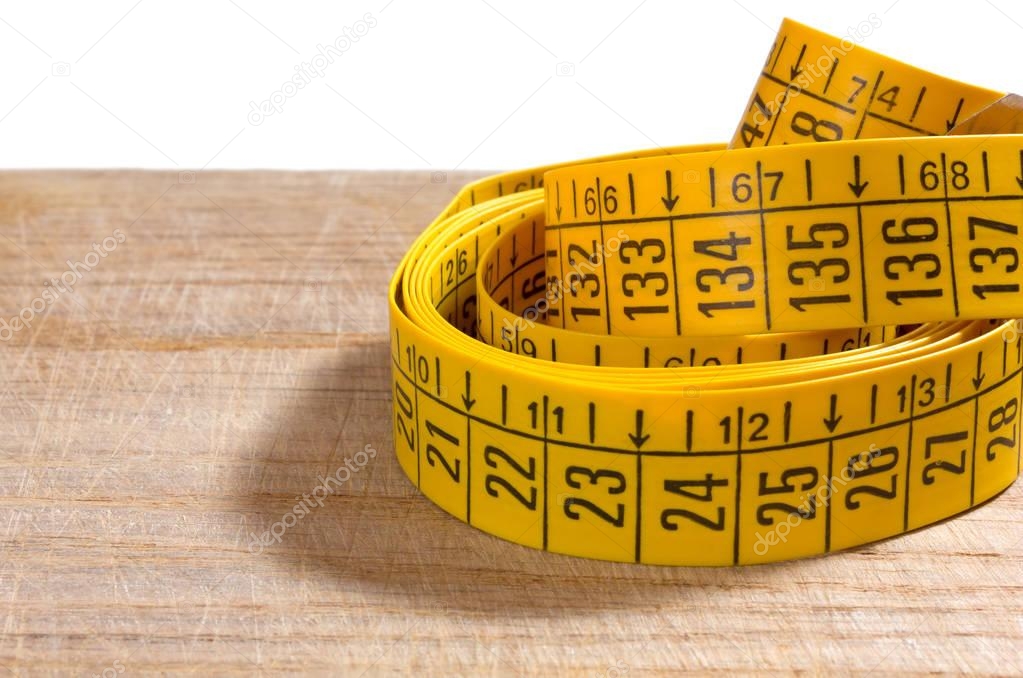 Measuring Tape on a Wooden Surface