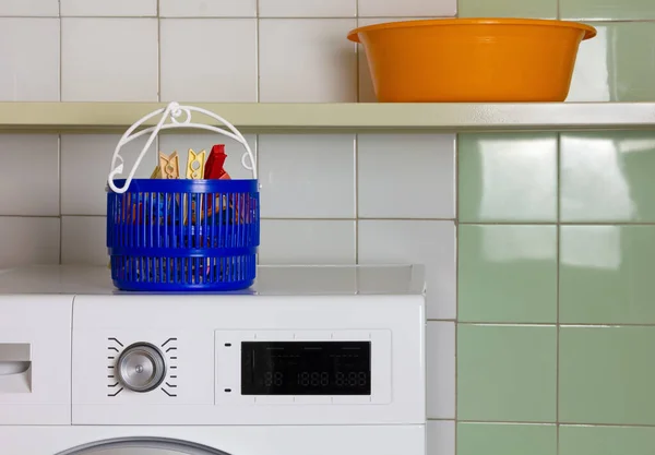 Basket for Clothespins on the Top of a Washing Machine in a Laun — Stock Photo, Image