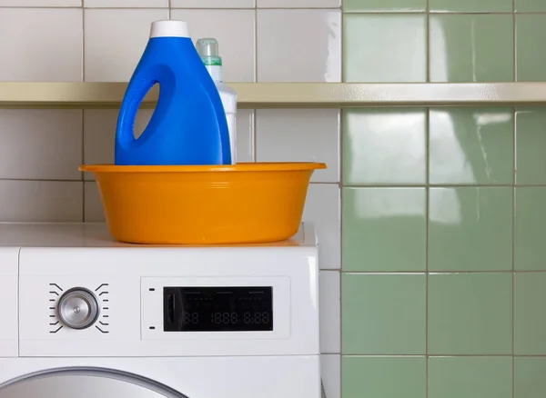 Two Bottles of Laundry Detergent in a Wash Bowl in a Laundry Roo — Stock Photo, Image