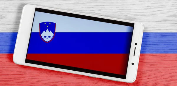 Flag Slovenia Composed Placing Smartphone Displaying Its Symbol Colored Wooden — Stock Photo, Image