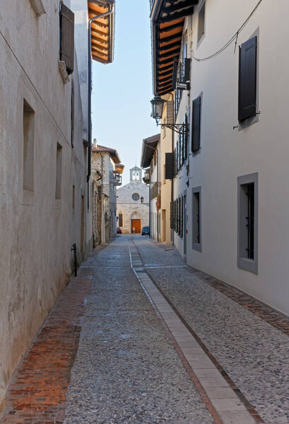 Pedestrian street in San Daniele del Friuli, Italy, leading to the ancient church of Santa Maria della Fratta