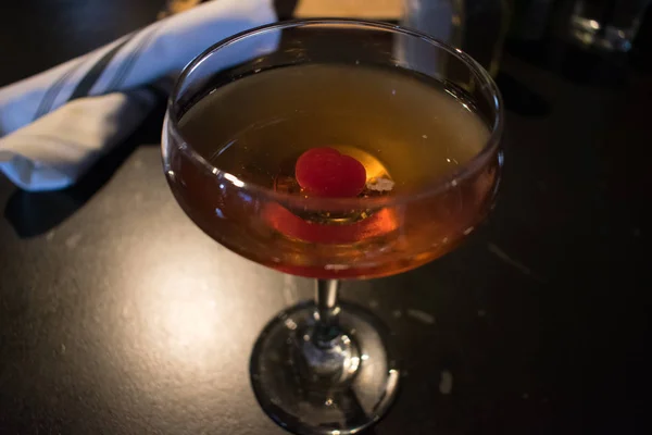 A cocktail with a cherry in it — Stock Photo, Image