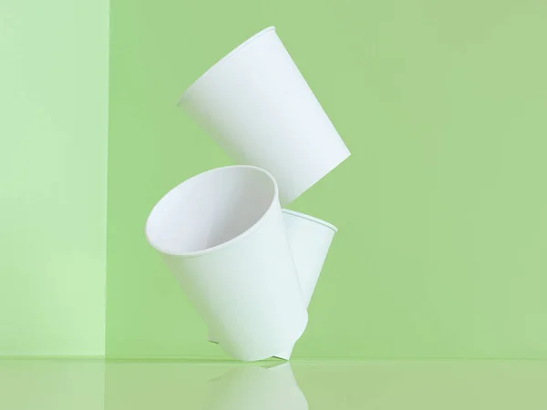 Modelo 3d de vasos de papel en el plano bajo luz natural. Fondo verde. renderizador 3d . — Foto de Stock