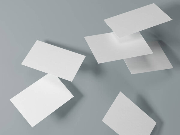 render 3d images of business cards dynamically scattered on a gray background.