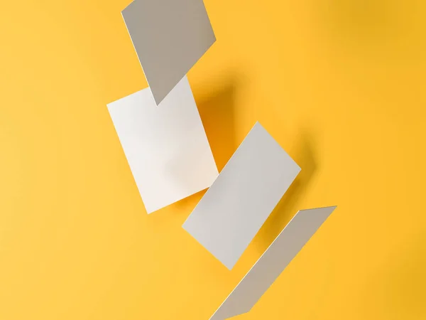 Renderizar imágenes 3D de tarjetas de visita dispersas dinámicamente sobre un fondo amarillo . —  Fotos de Stock