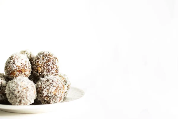 Energy balls on a white bowl on a white background — Stock Photo, Image