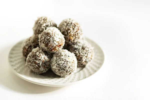 Energy balls on a white bowl on a white background — Stock Photo, Image