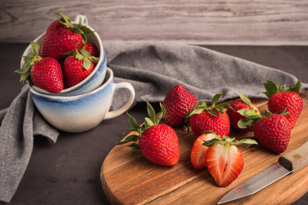Red berry strawberry in ceramic mugs