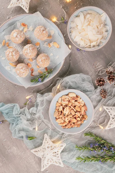 Homemade sweet white chocolate and coconut in a plate. Raffaello candy - snowball truffles on a Christmas table. Top view. — Stock Photo, Image