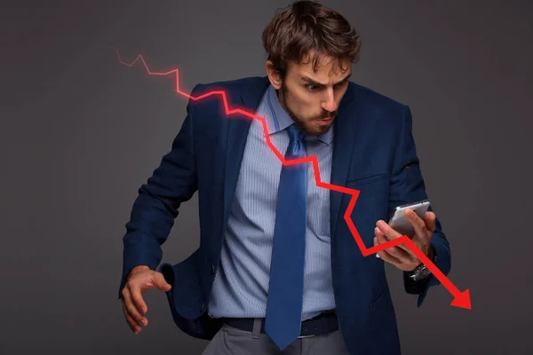 Businessman with chart in the fall, economy going down. — Stock Photo, Image