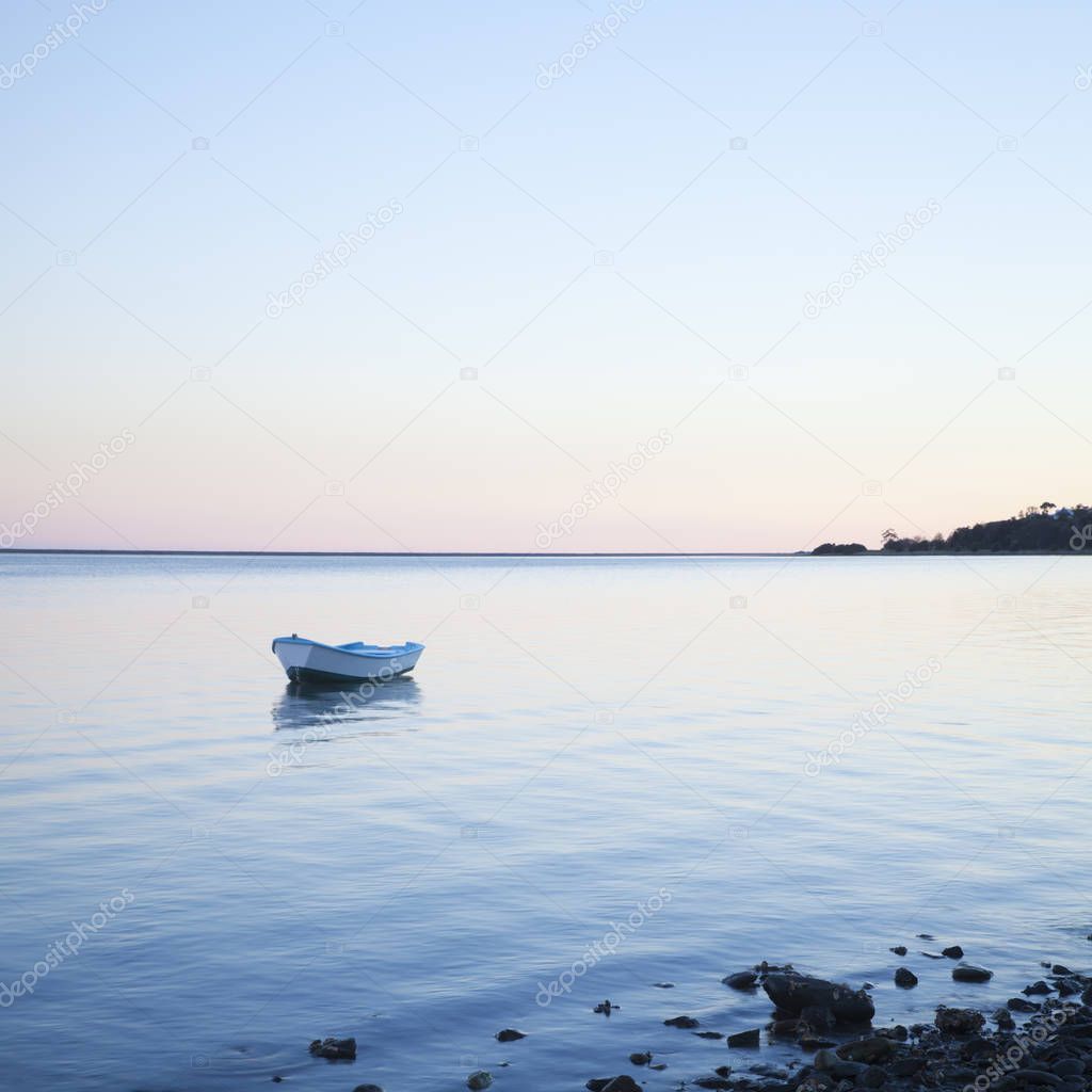 Small Boat on Gently Lapping Water
