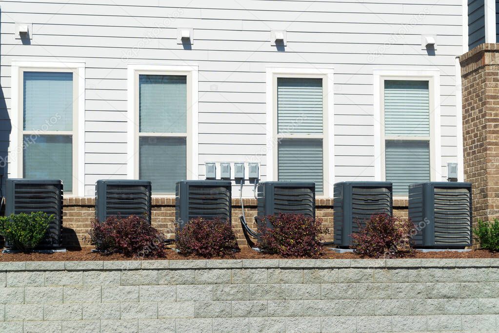 Air conditioner units connected to apartment building