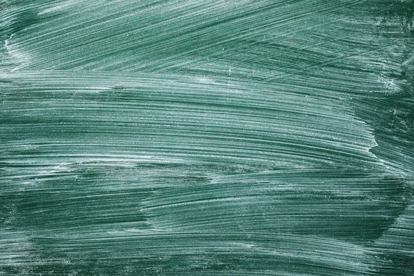 Grüne Tafel mit Kreide beschmiert Stockbild