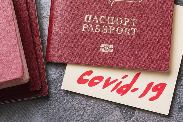 Text in Russian: passport. Concept on the topic of checking passengers in the passport control zone for coronavirus