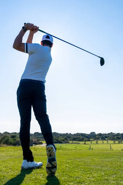 Golf player plays on a golf course