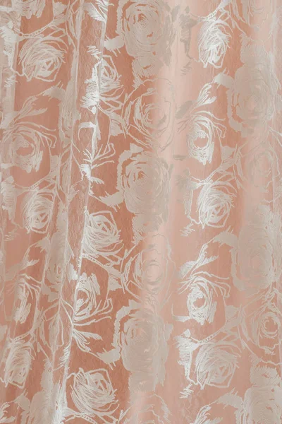 beautiful white fashion textile with rose flowers on pink background at wedding salon