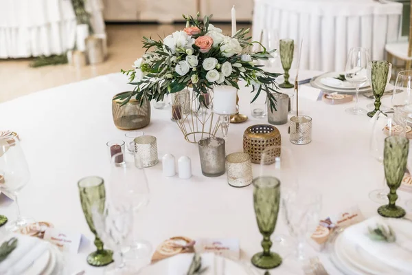 Close up of floral wedding decorations on table