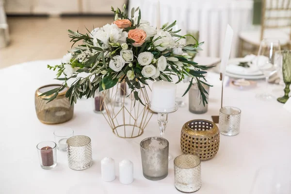 Close up of floral wedding decorations on table