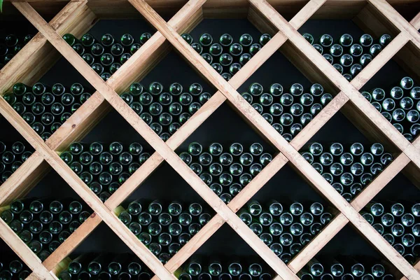 Bottles of wine in a wine cellar — Stock Photo, Image