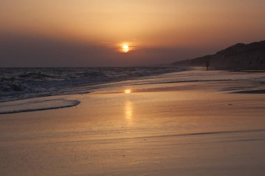 Sunset on the beach in Mazagon, Huelva, Andalusia, Atlantic coast, Spain clipart