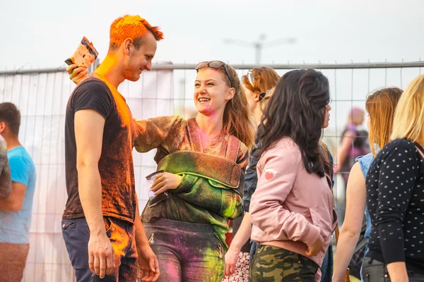 Krakow, Poland, 11 June, 2016: Festival of Colors in Krakow. Unidentified people dancing and celebrating during the color throw, Poland
