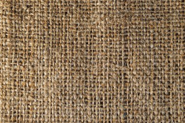 Bir kahverengi çuval bezi çanta dokulu arka plan yakın çekim