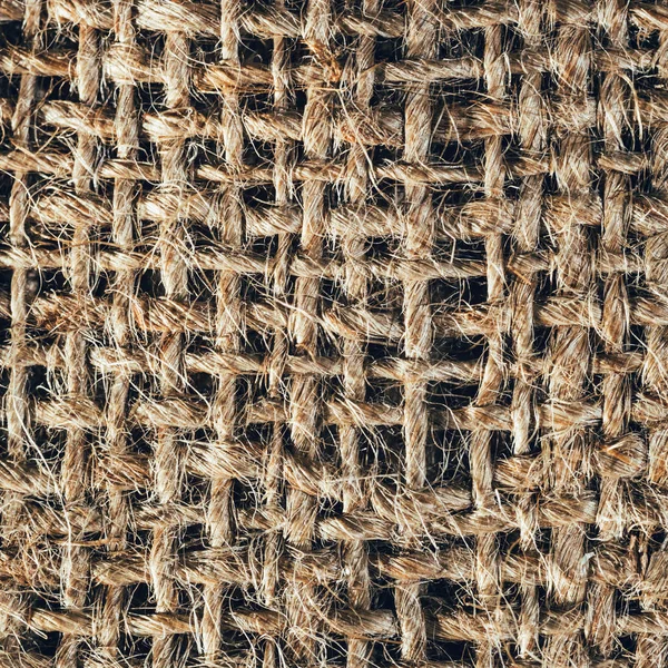 Texturerat bakgrund av en brun säckväv väska, närbild — Stockfoto
