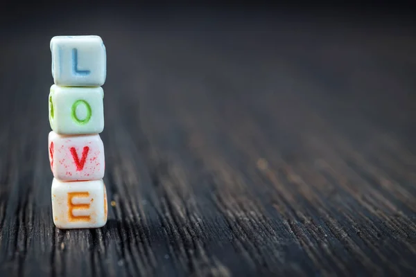 Word Love written in ceramic blocks — Stock Photo, Image