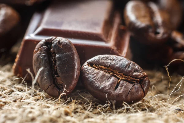 Close up of chocolate and coffee beans, shallow dof — Stock Photo, Image