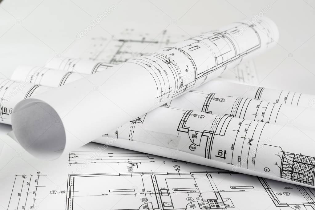 Architect rolls and house plans, close up