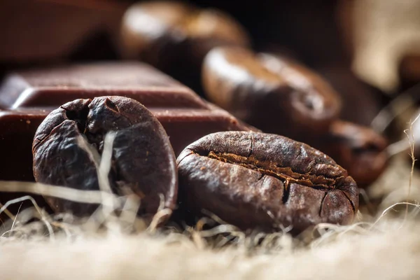 Close up of chocolate and coffee beans, shallow dof — Stock Photo, Image