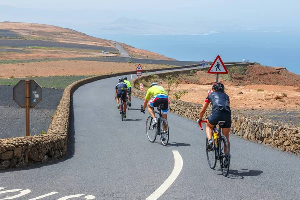 Lanzarote, Spain, March 31, 2017: Group of people ride down the bikes from Mirador del Rio — Stock Photo, Image