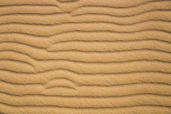 Čáry v písku pláže, zblízka — Stock fotografie