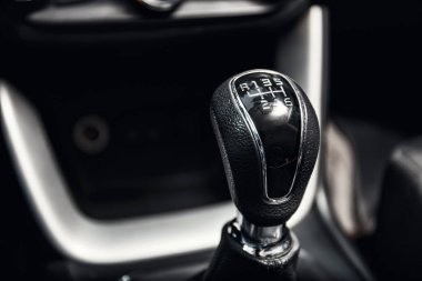 close up of gear shift in new modern car interior clipart