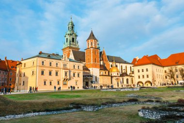 Krakow, Poland, January 14, 2018: Unknown people visit the  Wawel Castle in Krakow. Krakow is  one of the most famous landmark in Poland clipart