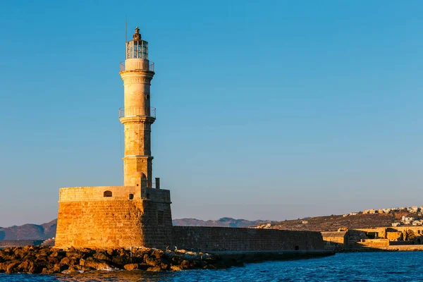 View of the entrance to Chania harbor with lighthouse at sunset, Crete, Greece — Stock Photo, Image