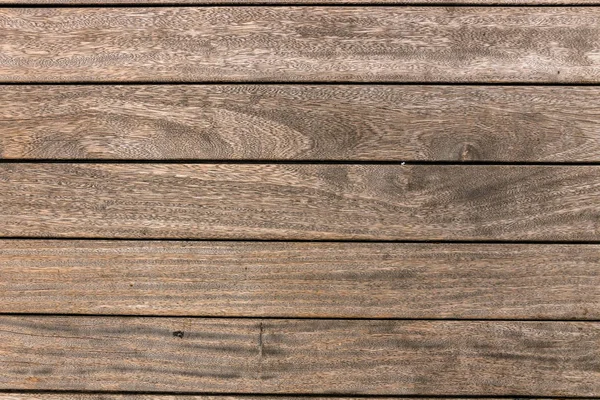 Holzhintergrund, Außenwand eines alten Gebäudes — Stockfoto