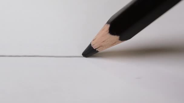 Drawing black line on white drawing paper with black color pencil. artistic concept. — Stock Video