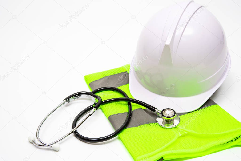 On a white background, there are safety hats, work clothes, and stethoscopes.