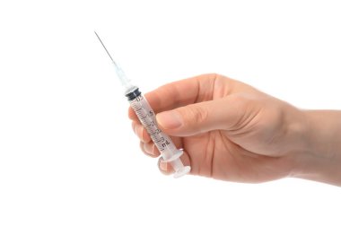 Şırıngayı tutan adamların yakınına.